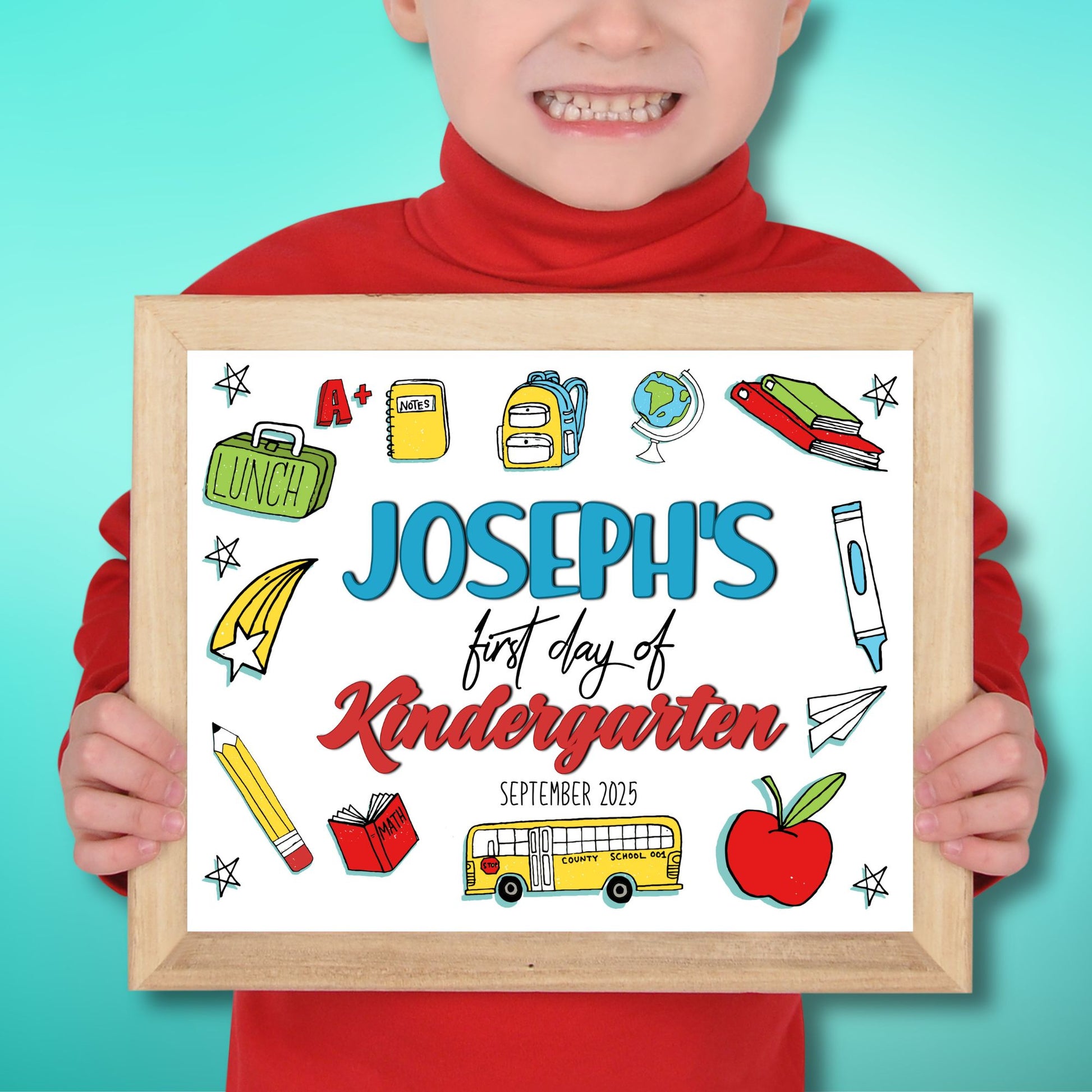 Child holding a framed sign for 'Joseph's first day of Kindergarten' with educational illustrations.