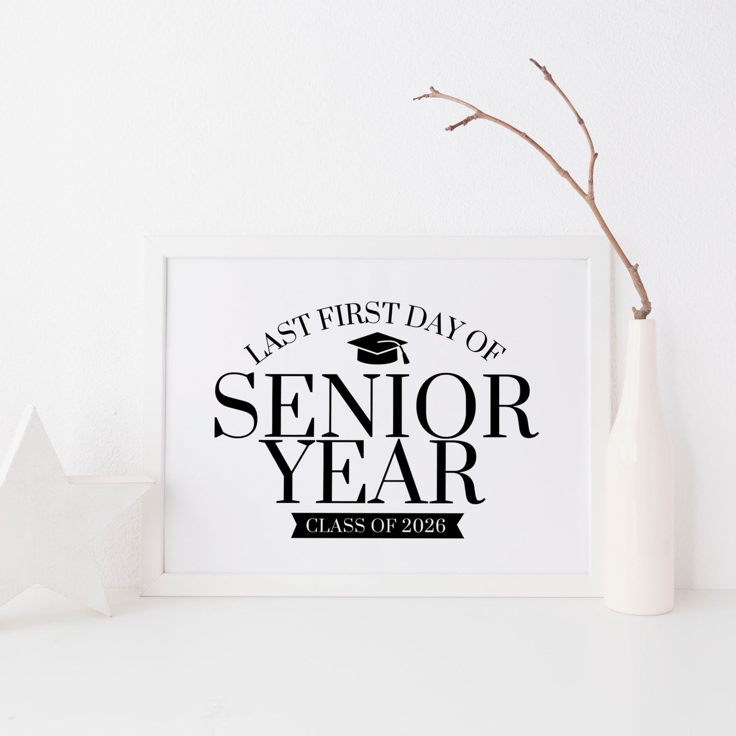 Framed sign with 'Last First Day of Senior Year Class of 2026' text on a white background
