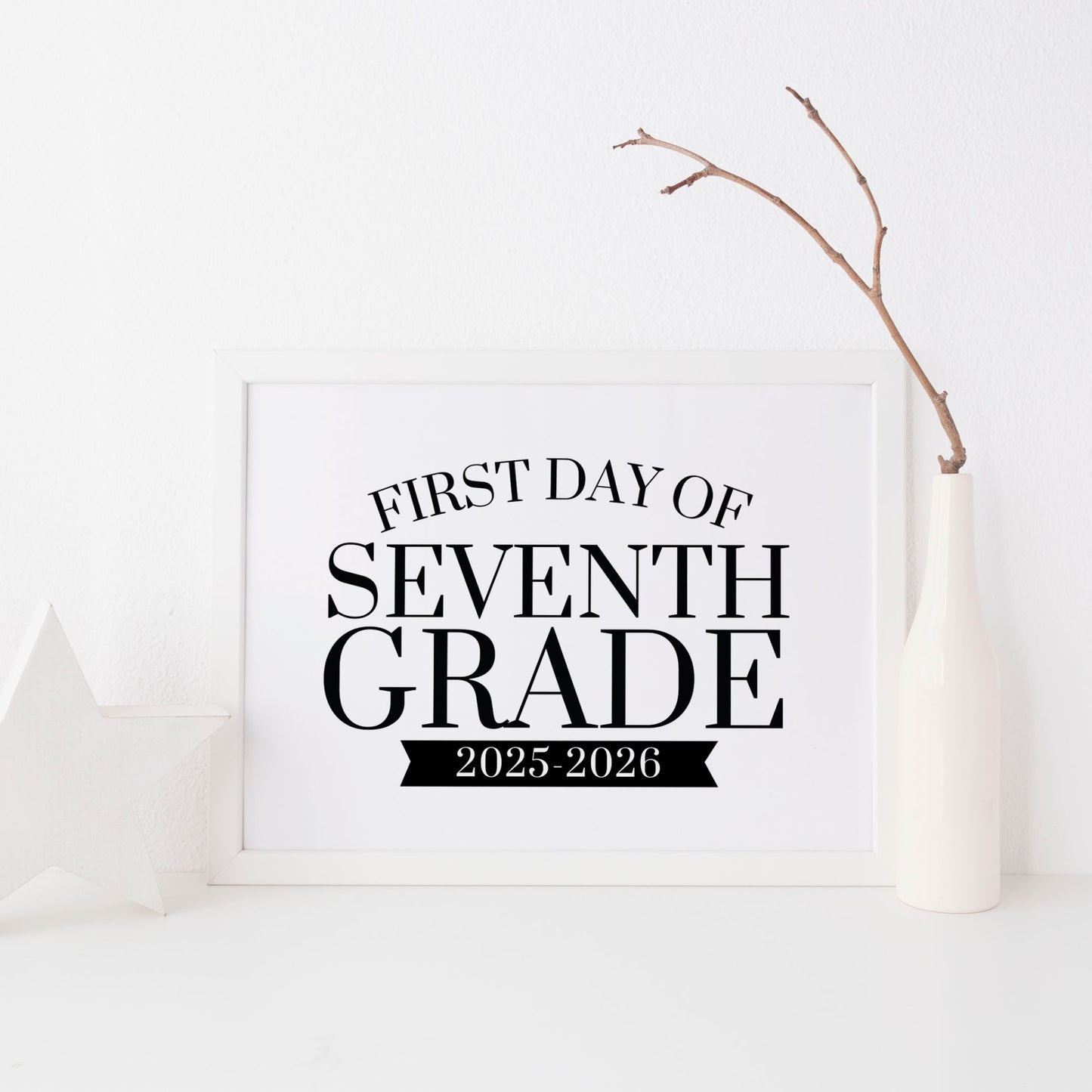 Framed sign with 'First Day of Seventh Grade 2025-2026' text on a white background