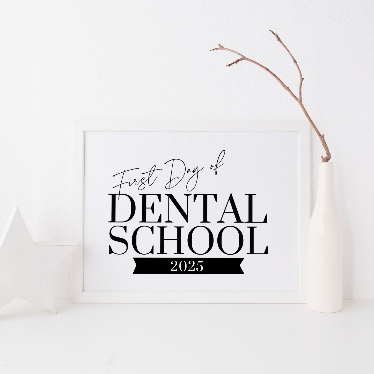 Framed sign with 'First Day of Dental School 2025' text on a white background