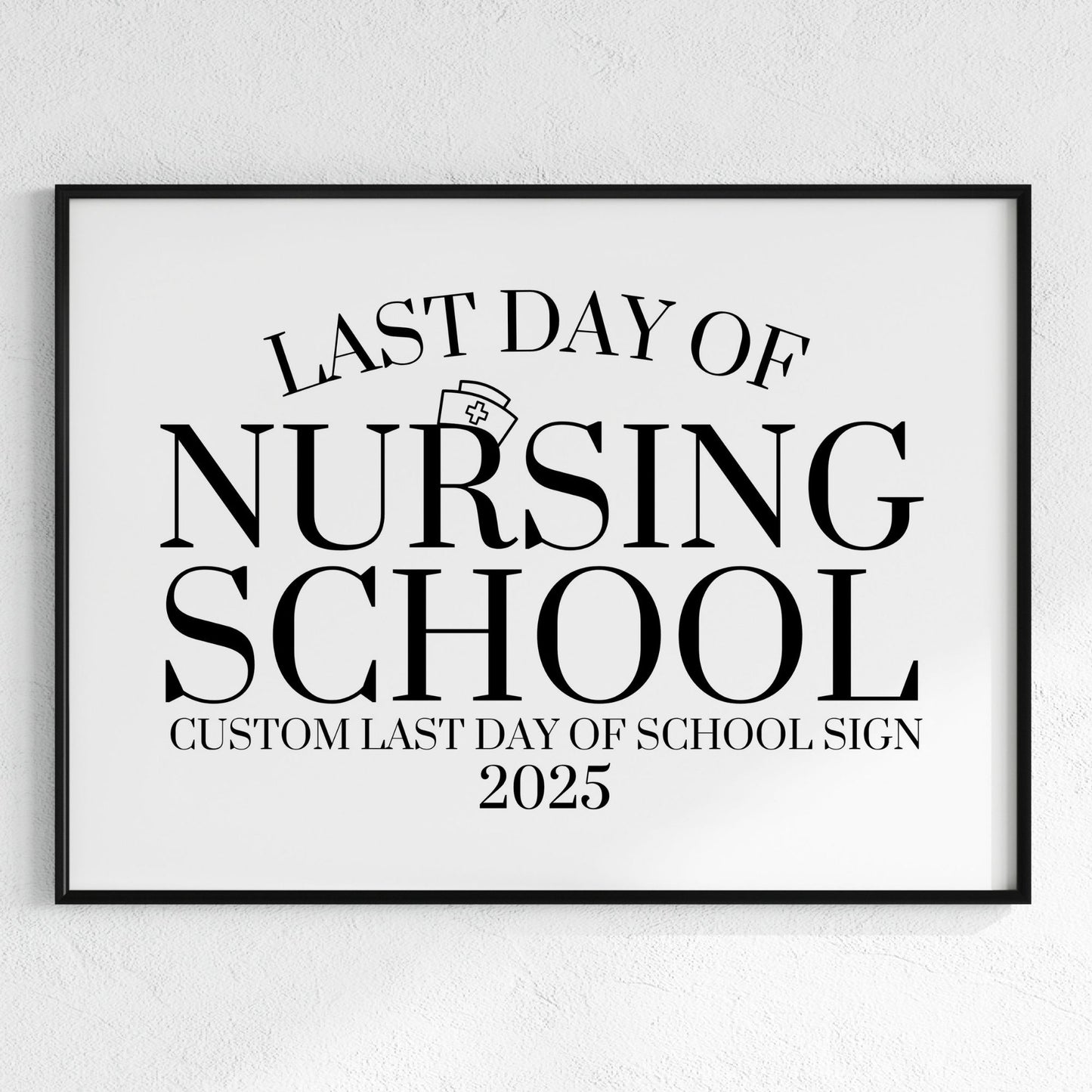 Framed sign with 'Last Day of Nursing School' text on a white wall