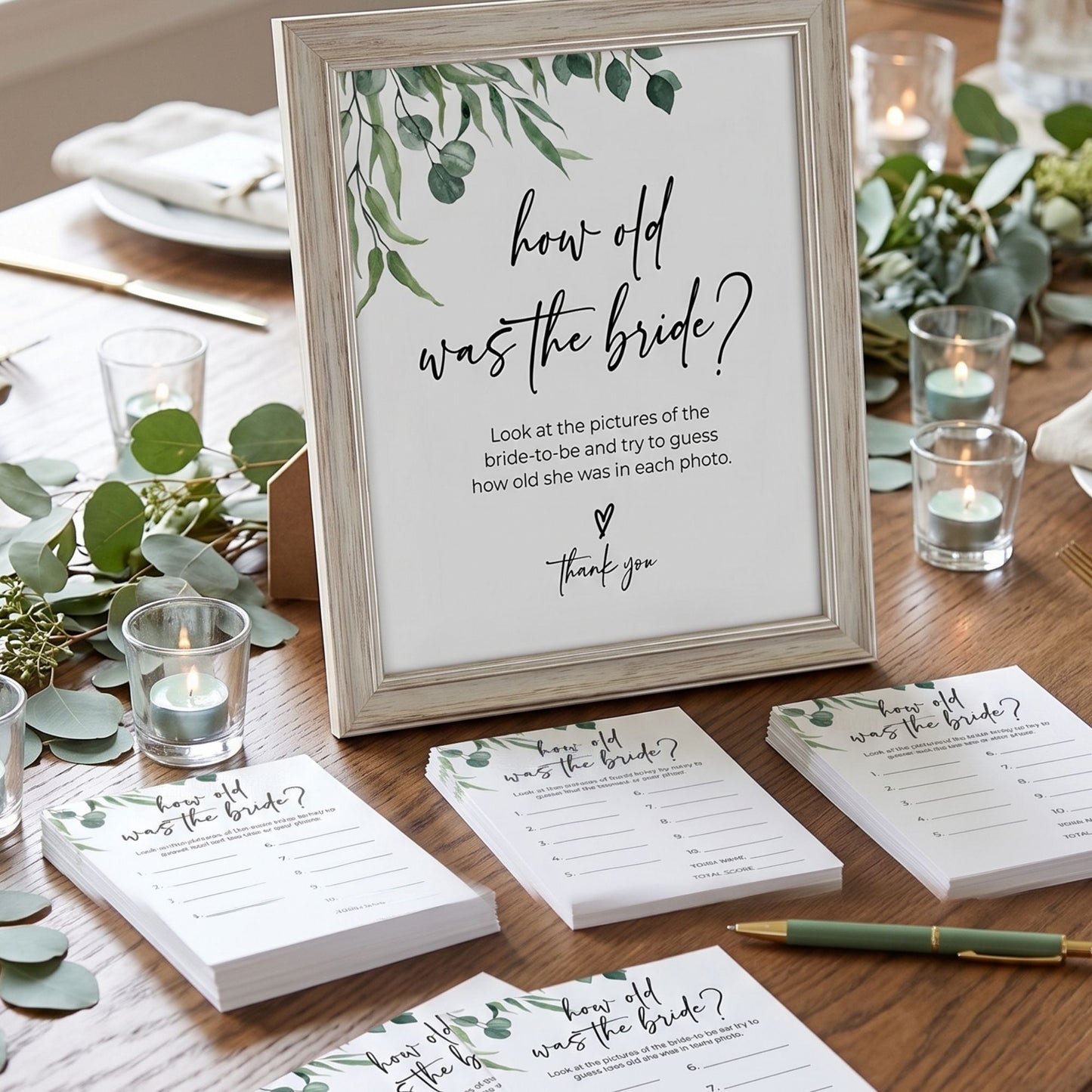 Wedding game cards titled 'How old was the bride?' on a table with candles and greenery.