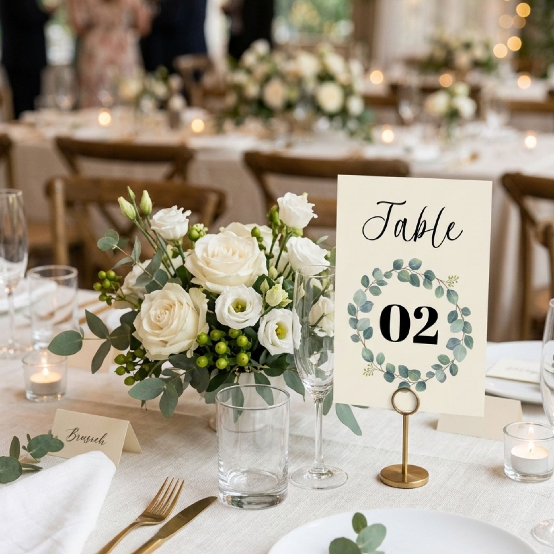 Decorated table setting with floral arrangement and table number sign.