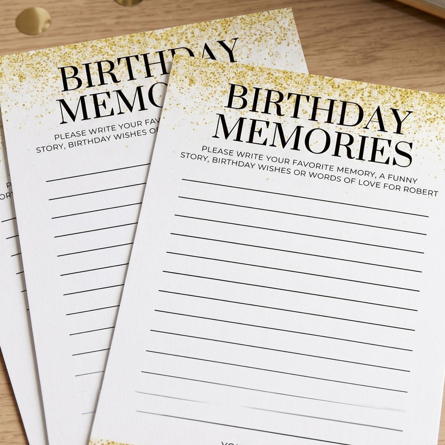 Two 'Birthday Memories' cards on a wooden surface with gold accents.