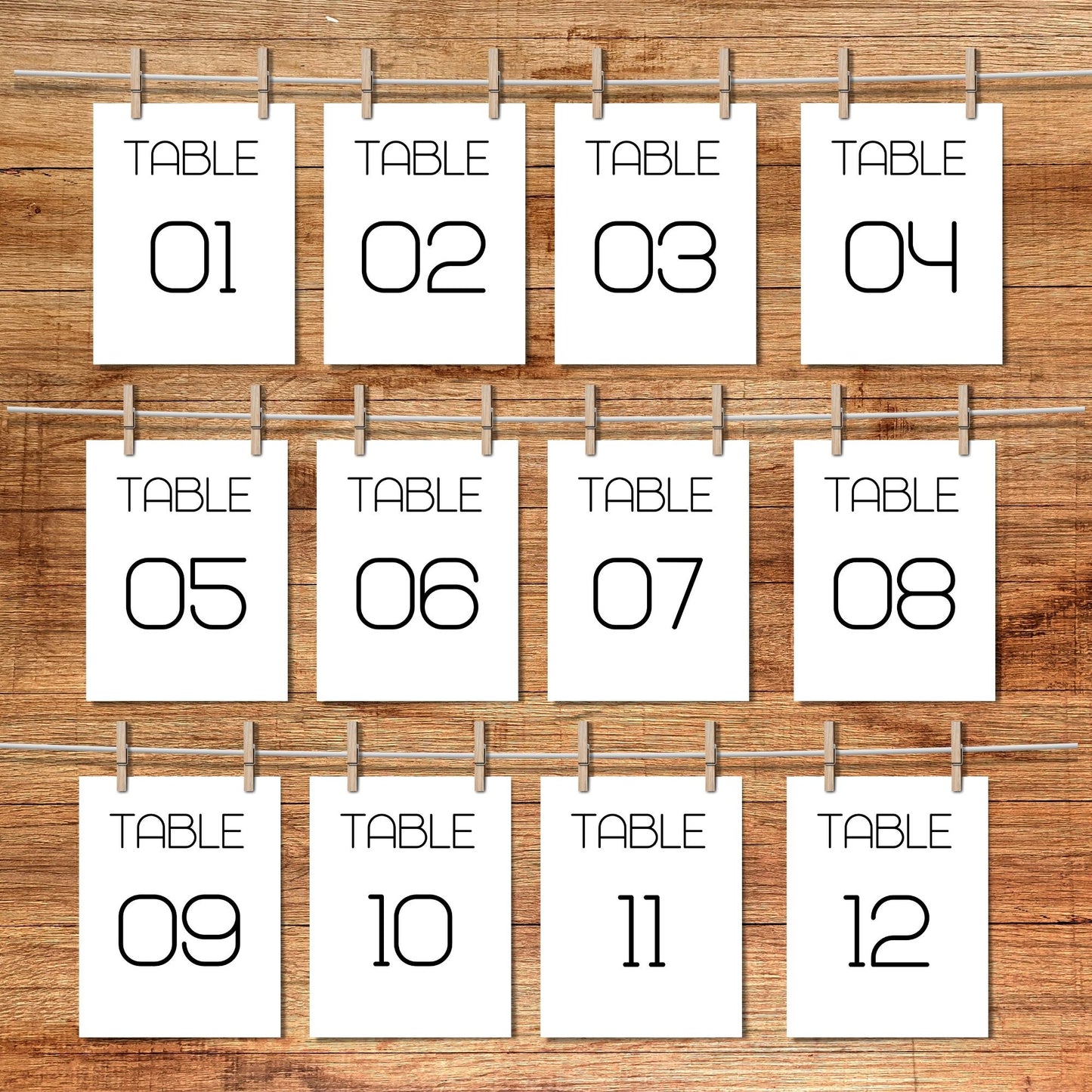 Set of table number cards from 01 to 12 on a wooden background
