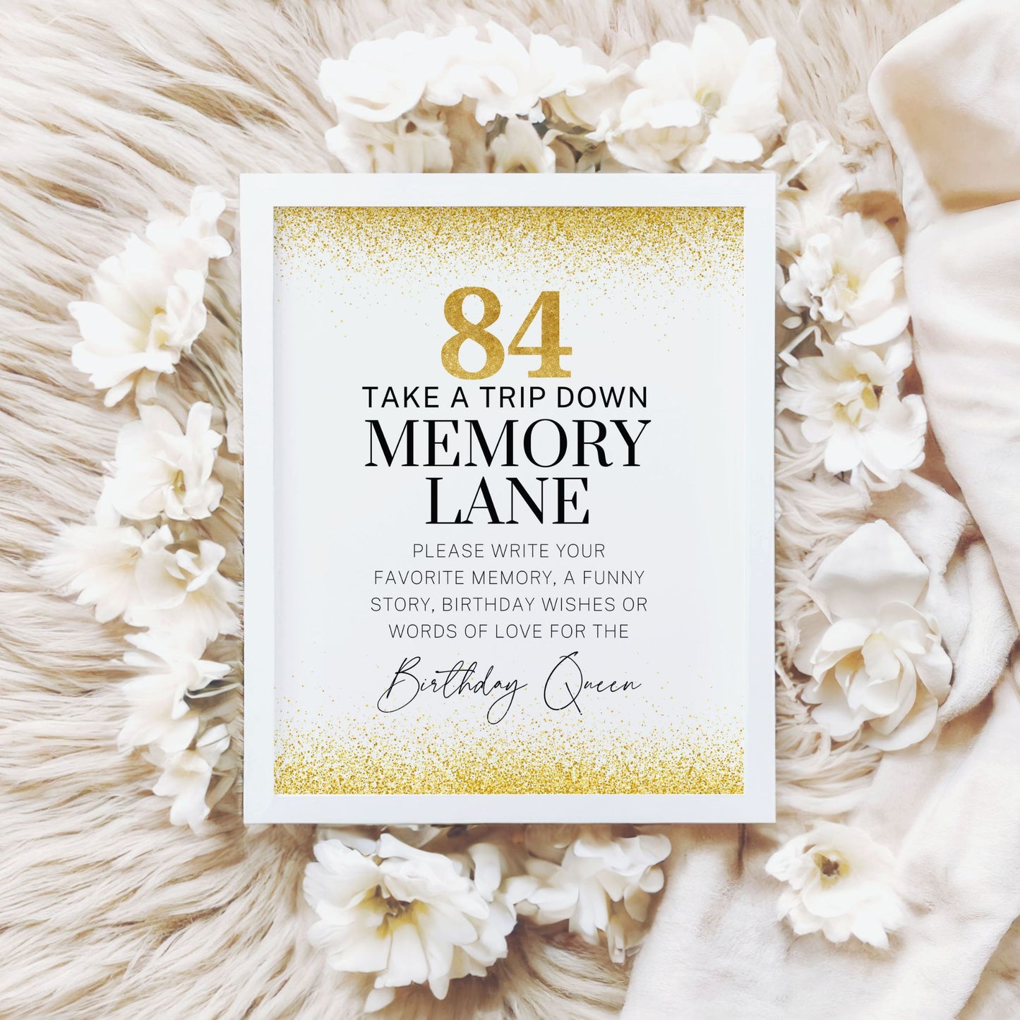 84th Birthday Memory Lane sign printable in gold glitter design, displayed in a white frame on a marble background.