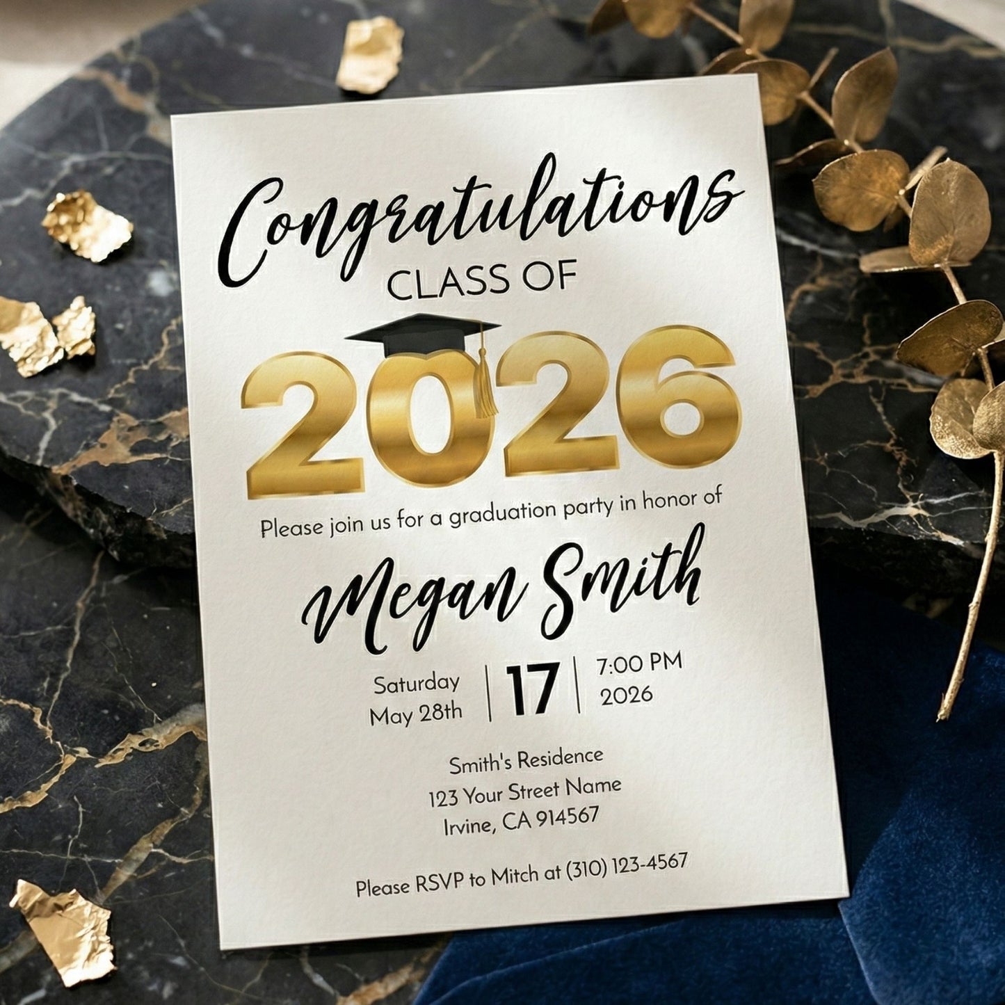 Graduation party invitation for Class of 2026 on a marble surface with gold accents.