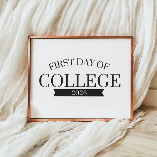 Framed sign with 'First Day of College 2026' text on a soft fabric background