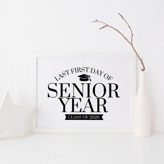 Framed sign with 'Last First Day of Senior Year Class of 2026' text on a white background