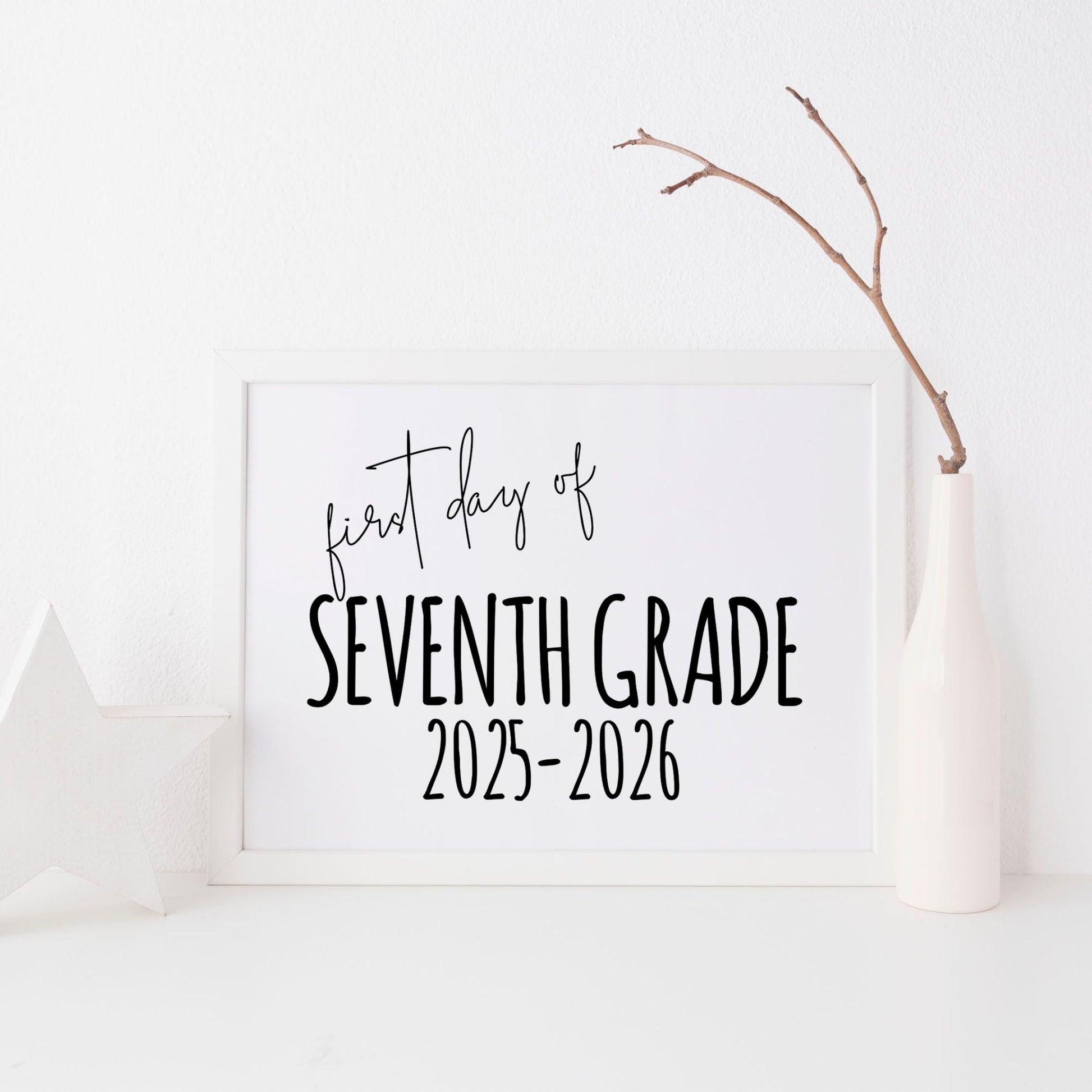 White board with 'first day of Seventh Grade 2025-2026' text on a white background with a branch.