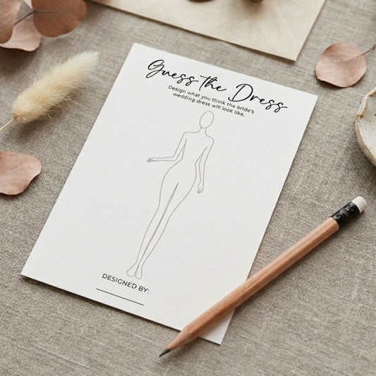 Sheet of paper with 'Guess the Dress' design prompt on a textured surface with a pencil.
