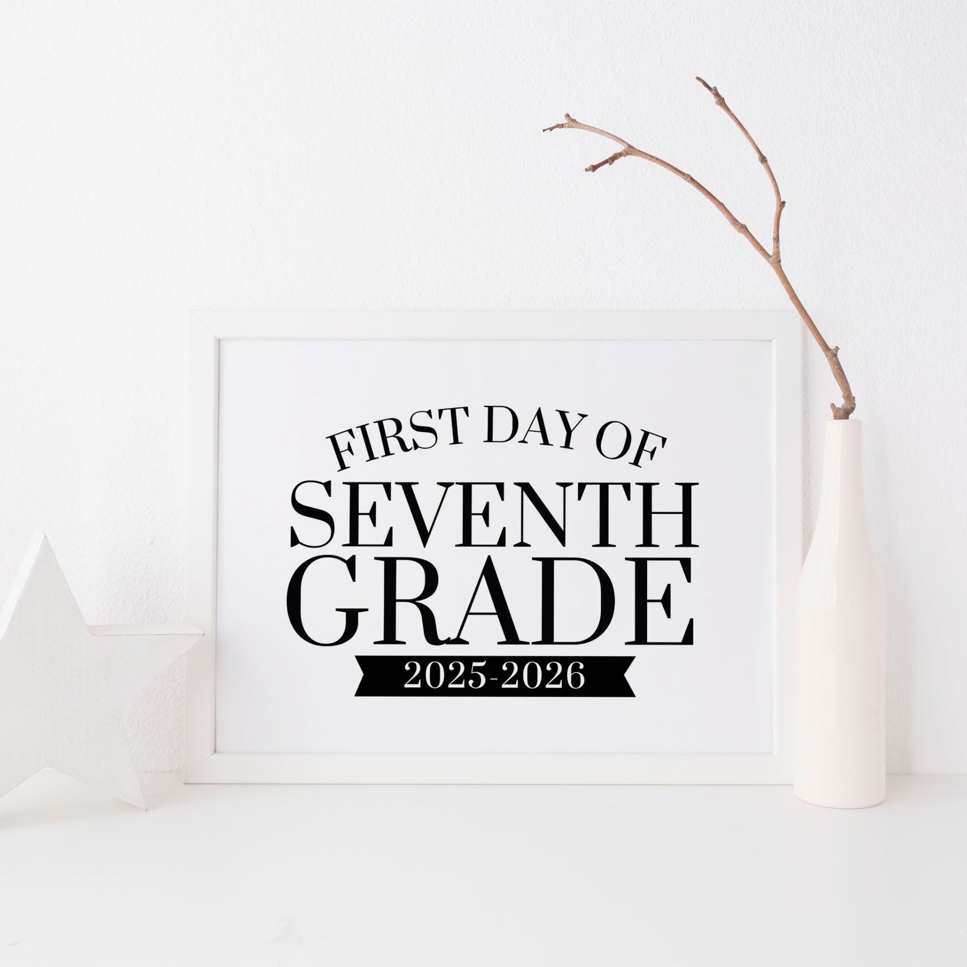 Framed sign with 'First Day of Seventh Grade 2025-2026' text on a white background