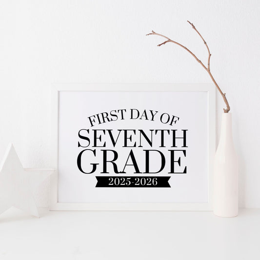 Framed sign with 'First Day of Seventh Grade 2025-2026' text on a white background