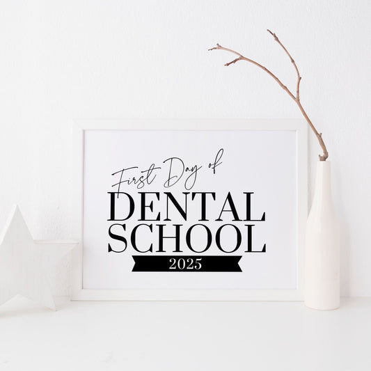 Framed sign with 'First Day of Dental School 2025' text on a white background