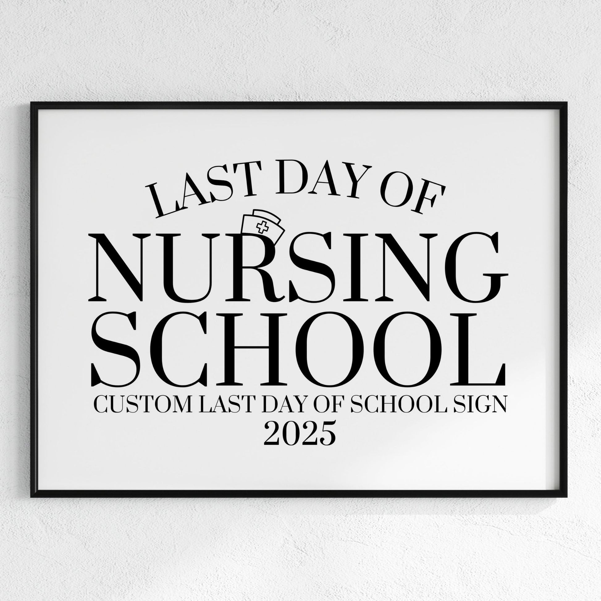 Framed sign with 'Last Day of Nursing School' text on a white wall