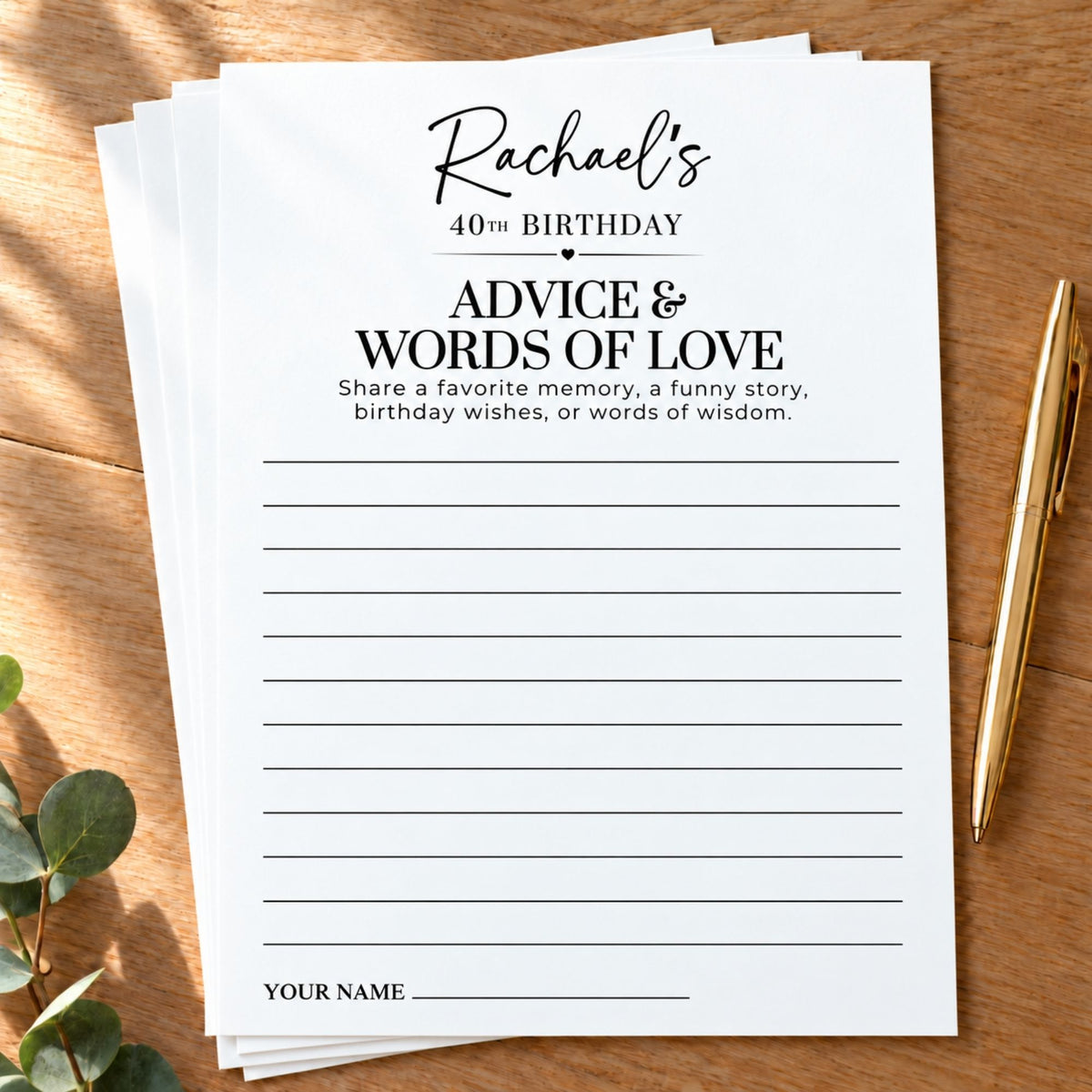 A stack of personalized birthday writing cards for a 40th birthday, featuring black text on a white background, styled on a wooden table next to a gold pen and eucalyptus leaves.