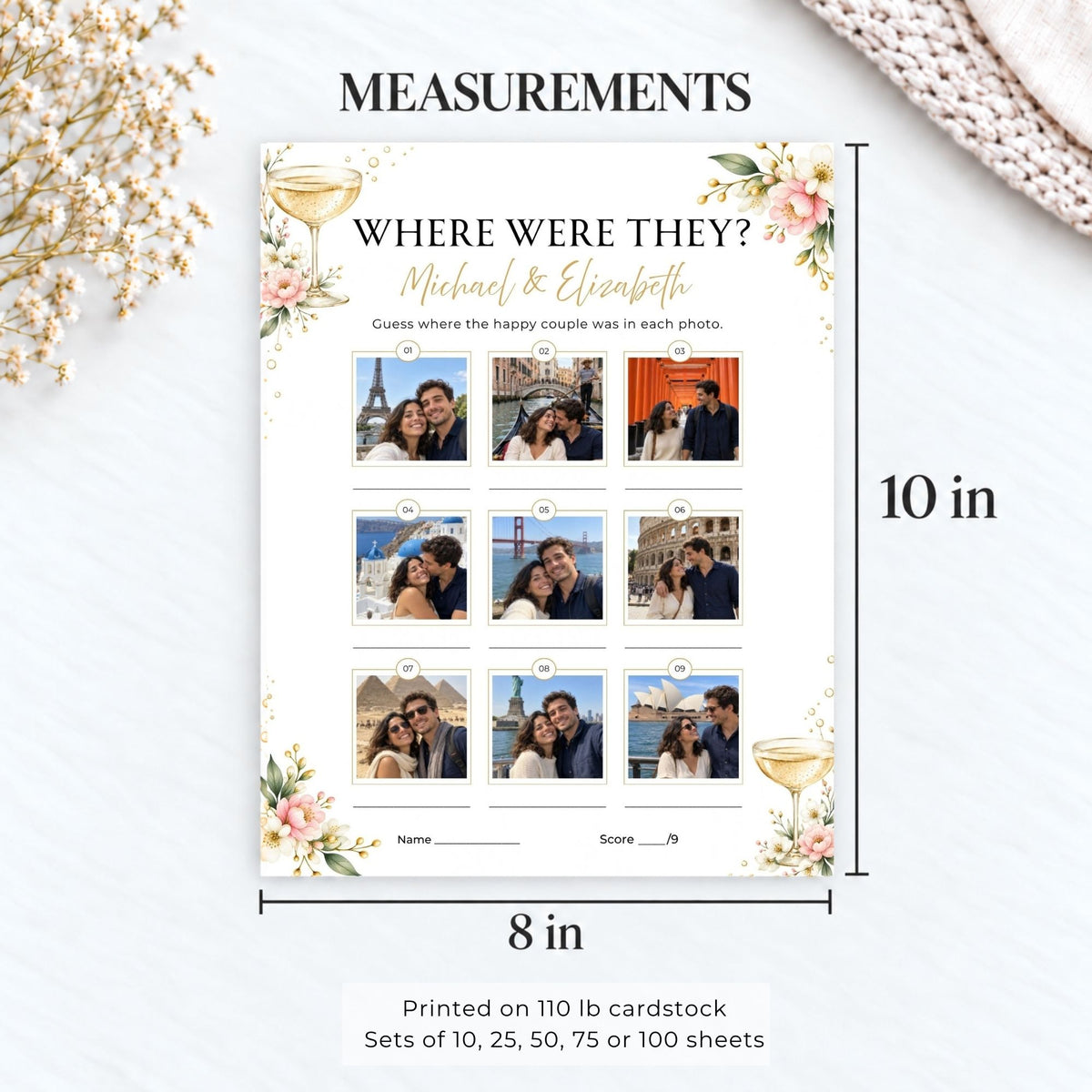 A printed measurement graphic for a 'Where Were They?' couple photo guessing game, showing an 8 by 10 inch cardstock sheet with floral corners, photo placeholders, and dimensions labeled 10 in tall by 8 in wide. The layout is styled on a light textured background with dried flowers and a knit fabric corner.