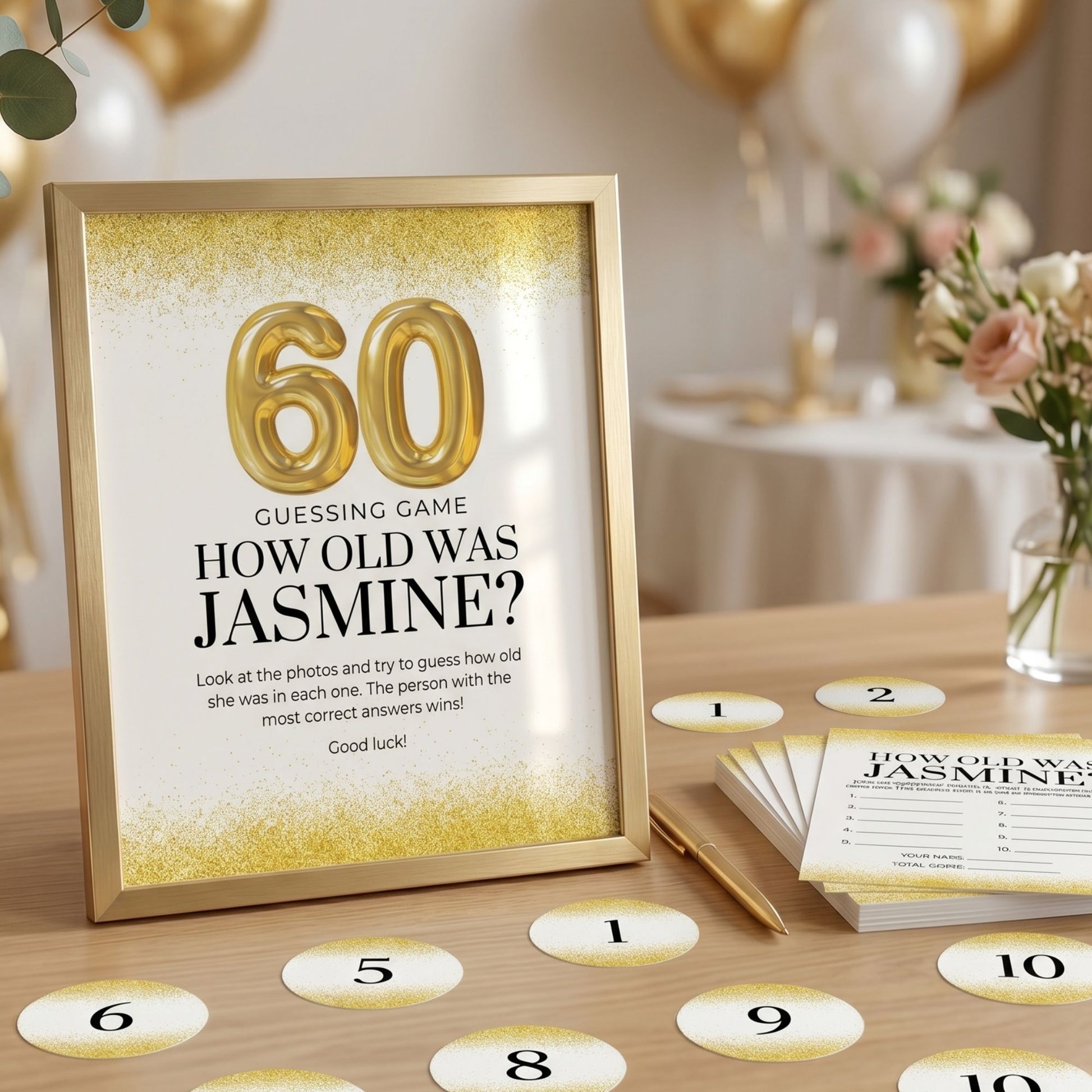 Gold 60th birthday guessing game display featuring an 8x10 framed “How Old Was Jasmine?” sign, 5x7 game cards, and numbered round labels arranged on a wooden table with elegant gold party decor.
