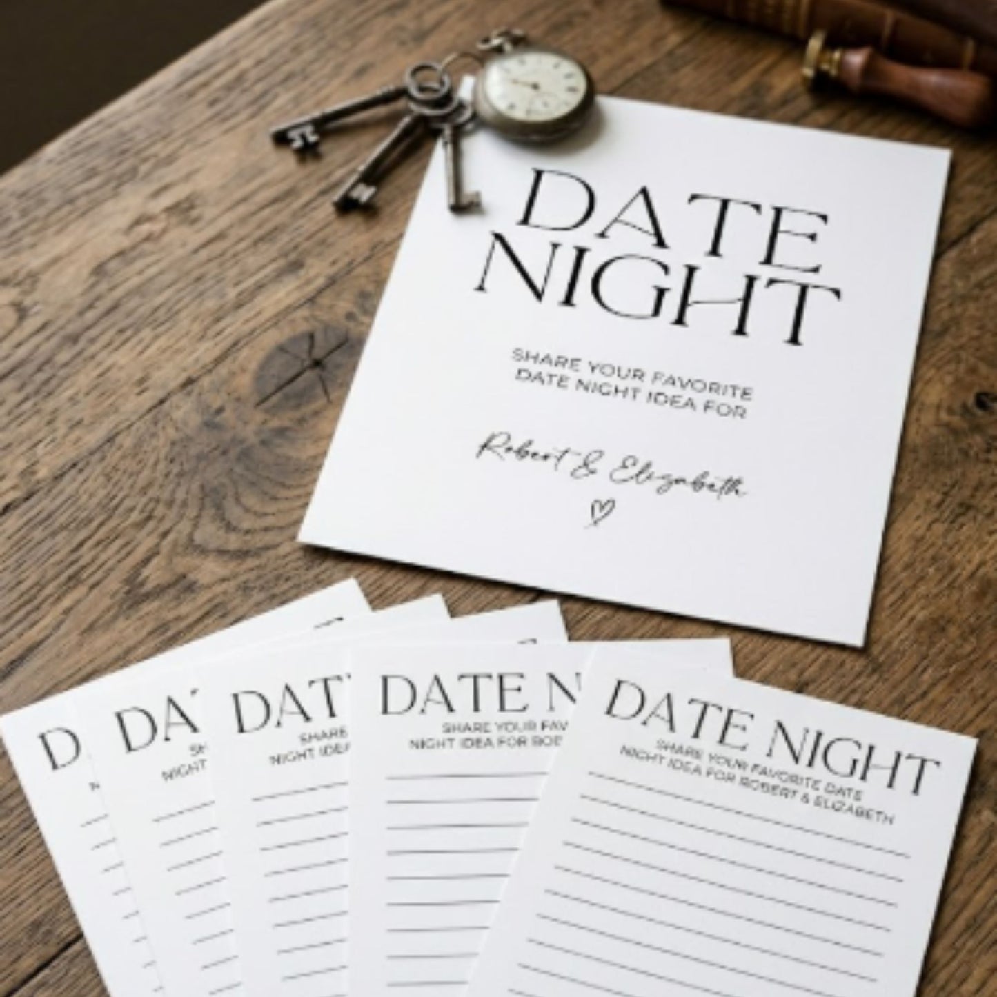 Personalized date night bridal shower game sign and matching lined advice cards on rustic wood table with vintage keys and neutral modern wedding decor.