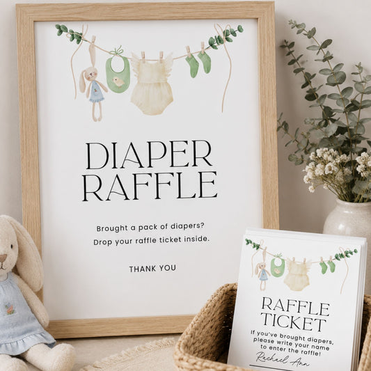 Framed 'Diaper Raffle' poster with raffle ticket on a neutral background