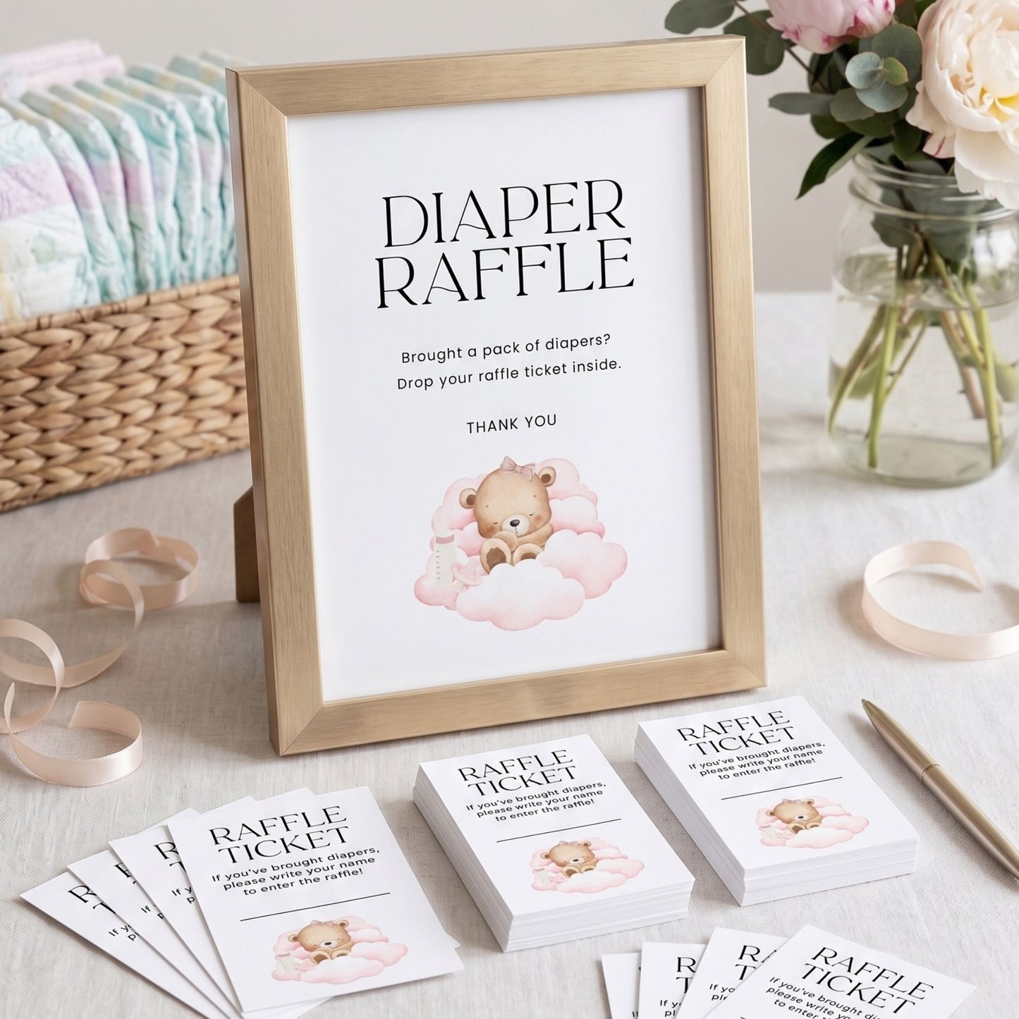 Diaper raffle sign with teddy bear illustration on a table with raffle tickets and flowers.