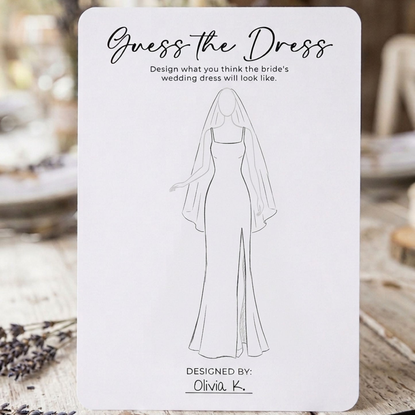 Card with a line drawing of a wedding dress on a blurred background