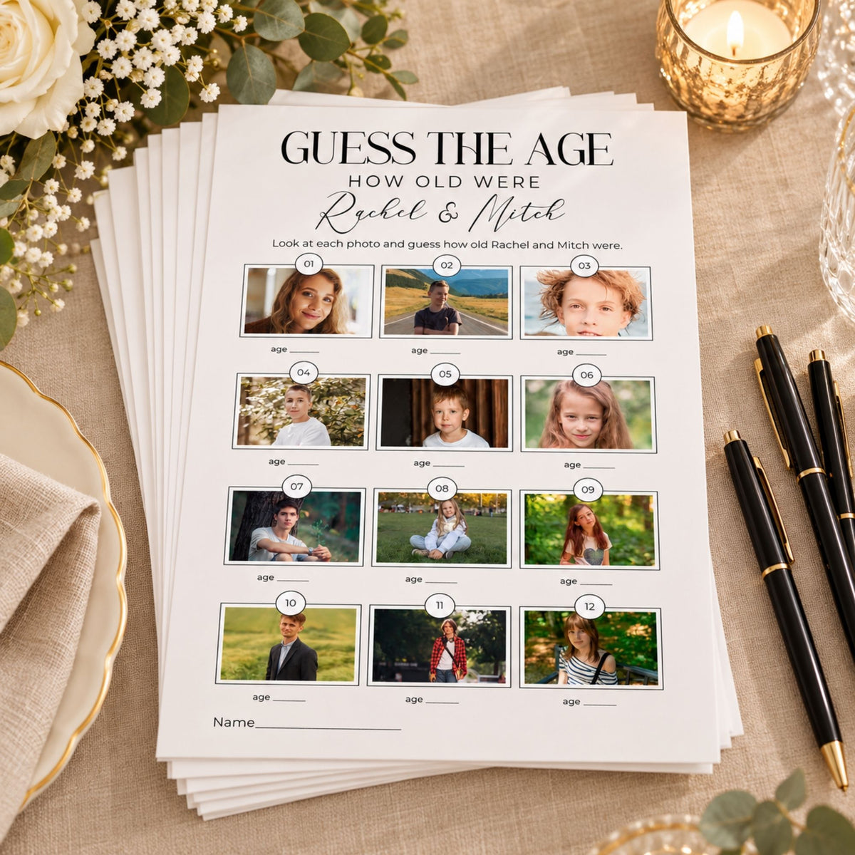 A stack of printed party game cards titled 'GUESS THE AGE HOW OLD WERE Rachel & Mitch' shown on a beige tablecloth with flowers, a candle, and black pens around it.