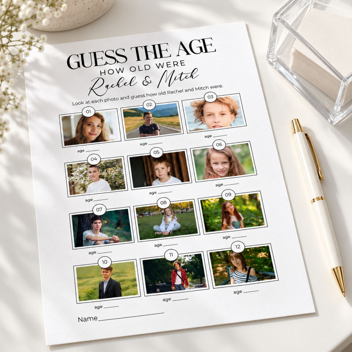 A printed party game sheet titled 'GUESS THE AGE HOW OLD WERE Rachel & Mitch' laid on a white surface, surrounded by a cream pen, a clear glass container, and dried flowers. The sheet contains 12 photo cards with blank age circles underneath.