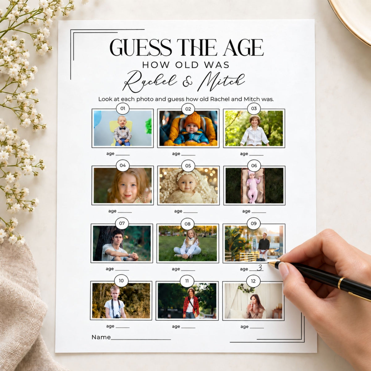 A printed 'Guess the Age' activity sheet with 12 small portrait photos and blank age lines, styled on a light surface with flowers and a hand holding a pen at the lower right.