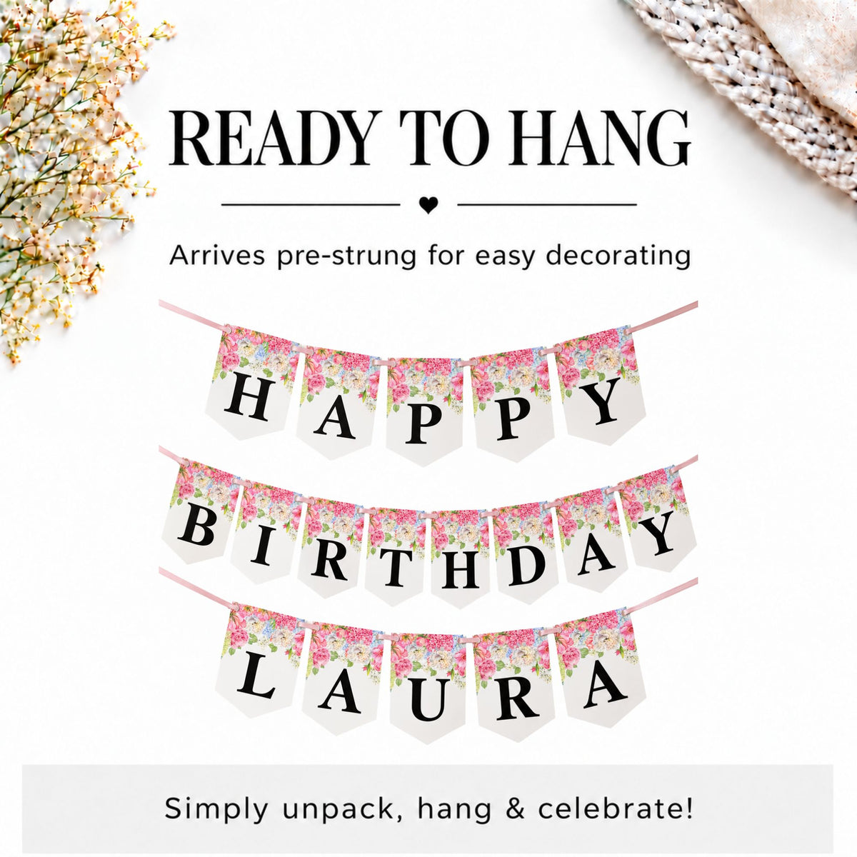 A 'Happy Birthday Laura' hanging banner set displayed on a clean white background with decorative floral elements in the corners. The banner consists of three rows: 'HAPPY' and 'BIRTHDAY' in black block letters on pink and white floral patterned pennants, and 'LAURA' in black block letters on white pennants.