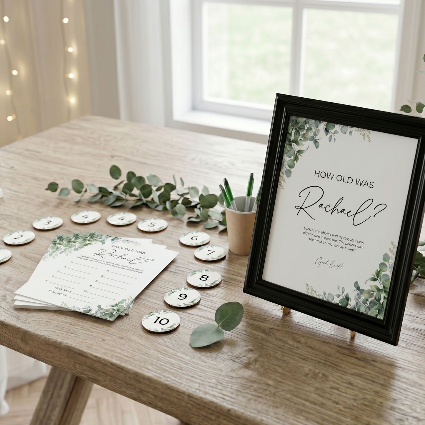 Decorative table setting with a framed question card and table numbers on a wooden table.