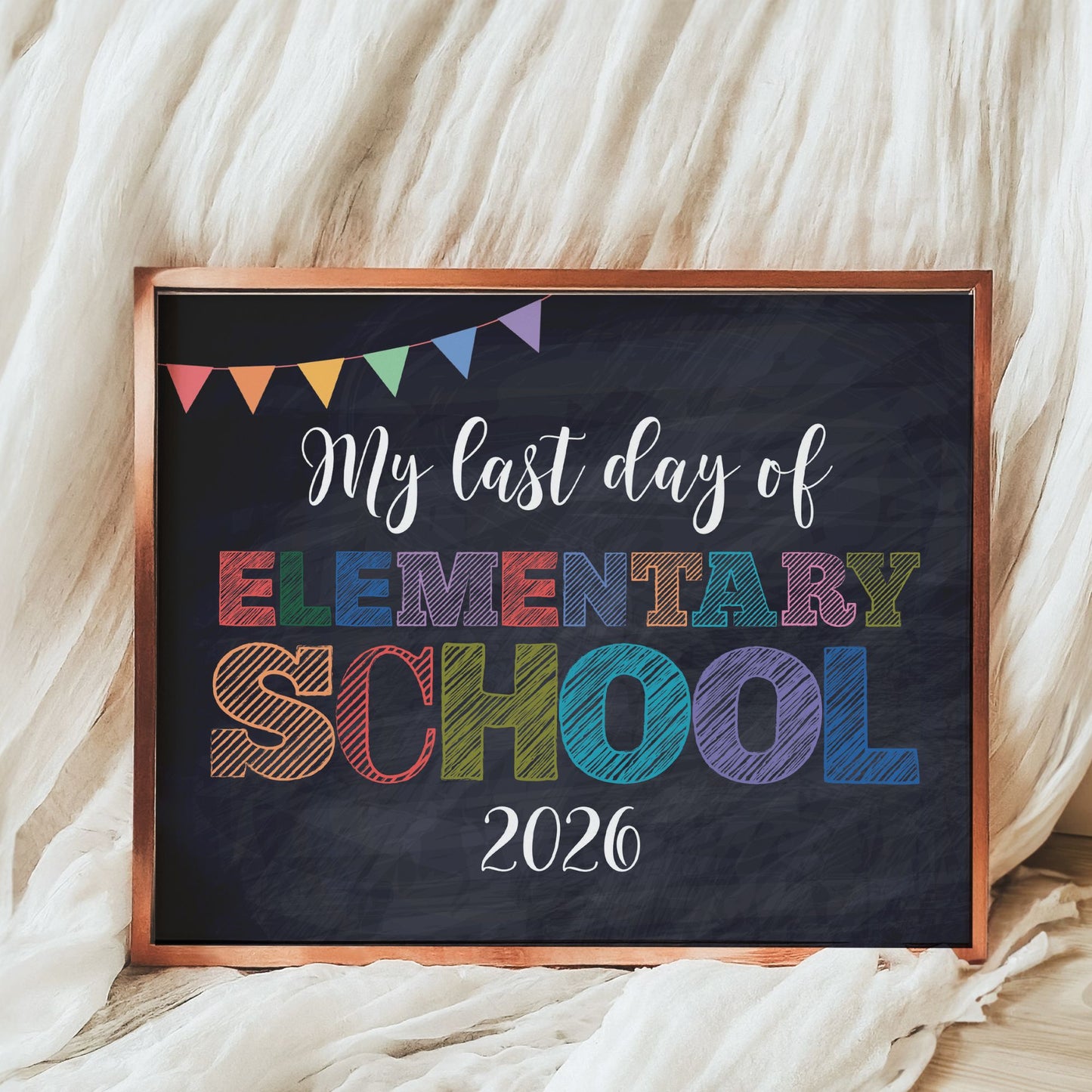 Decorative sign with 'My last day of Elementary School 2026' text on a blackboard background.