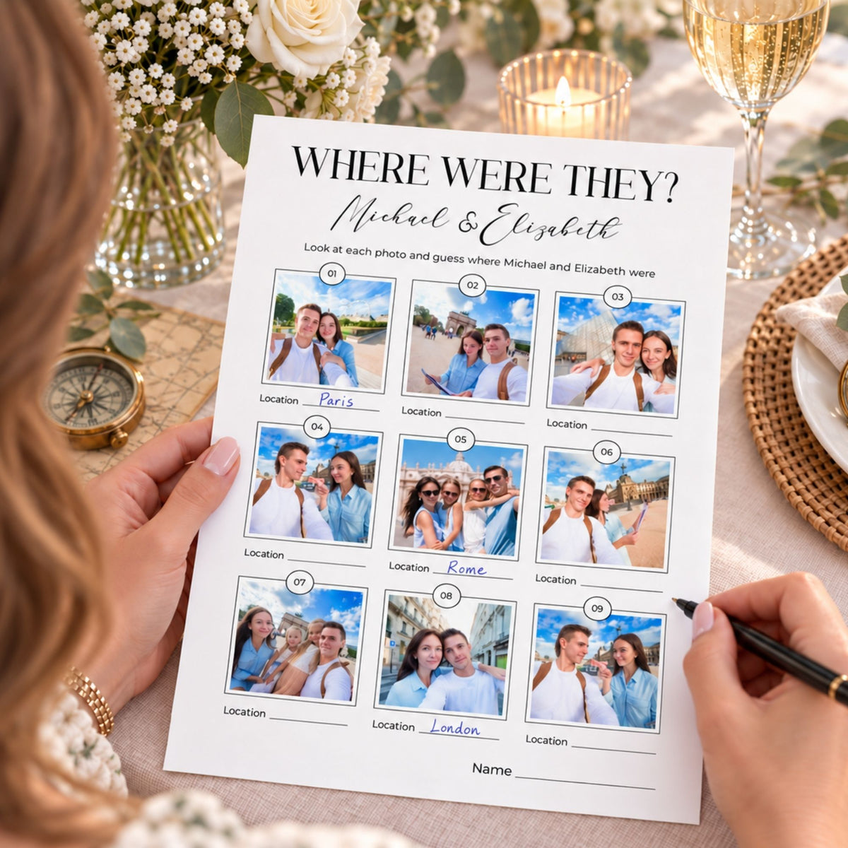 A personalized photo memory sheet titled 'WHERE WERE THEY? Michael & Elizabeth' held by two hands at a styled dining table. The white paper features nine slots for couple photos with handwritten location labels including Paris, Rome, and London, surrounded by champagne glasses, flowers, and a gold compass.
