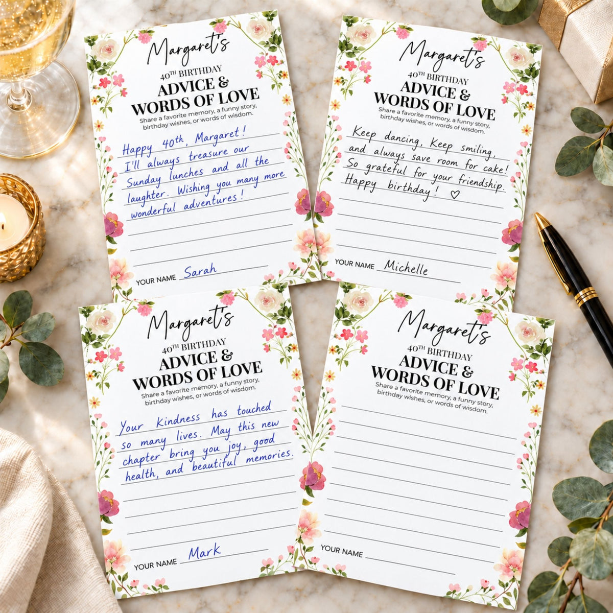 Four floral guest book pages arranged on a marble surface with a gold pen, wrapped gift box, and greenery. The pages are personalized with the title 'Margaret's 60th Birthday' and sections for advice and words of love.