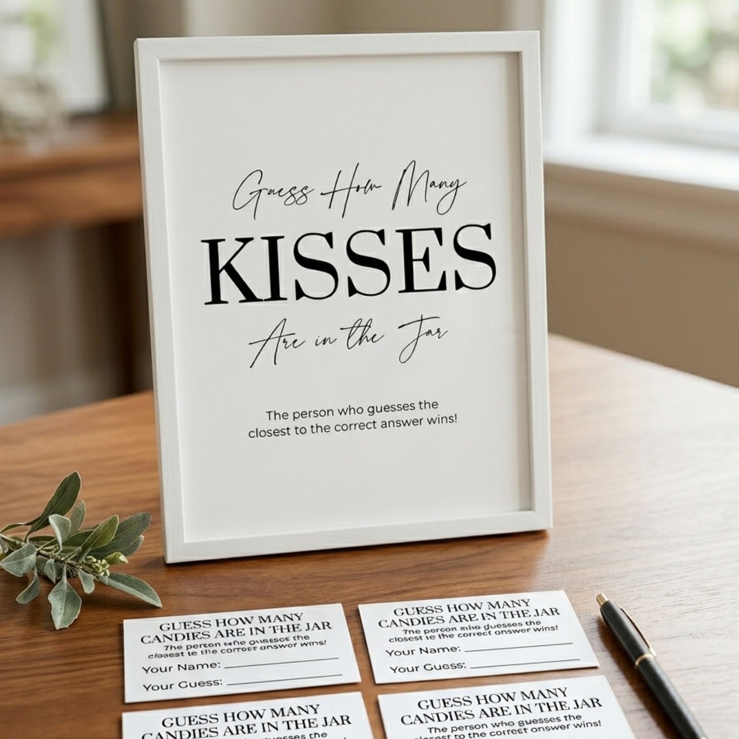 Framed game card with 'Guess How Many Kisses Are in the Jar' text on a wooden surface.