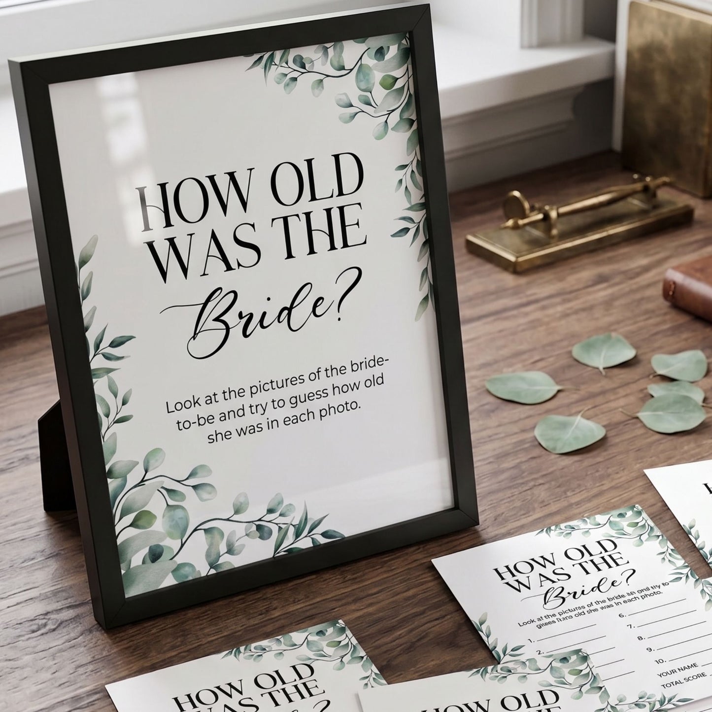 Framed question 'How old was the Bride?' with decorative elements on a wooden surface.