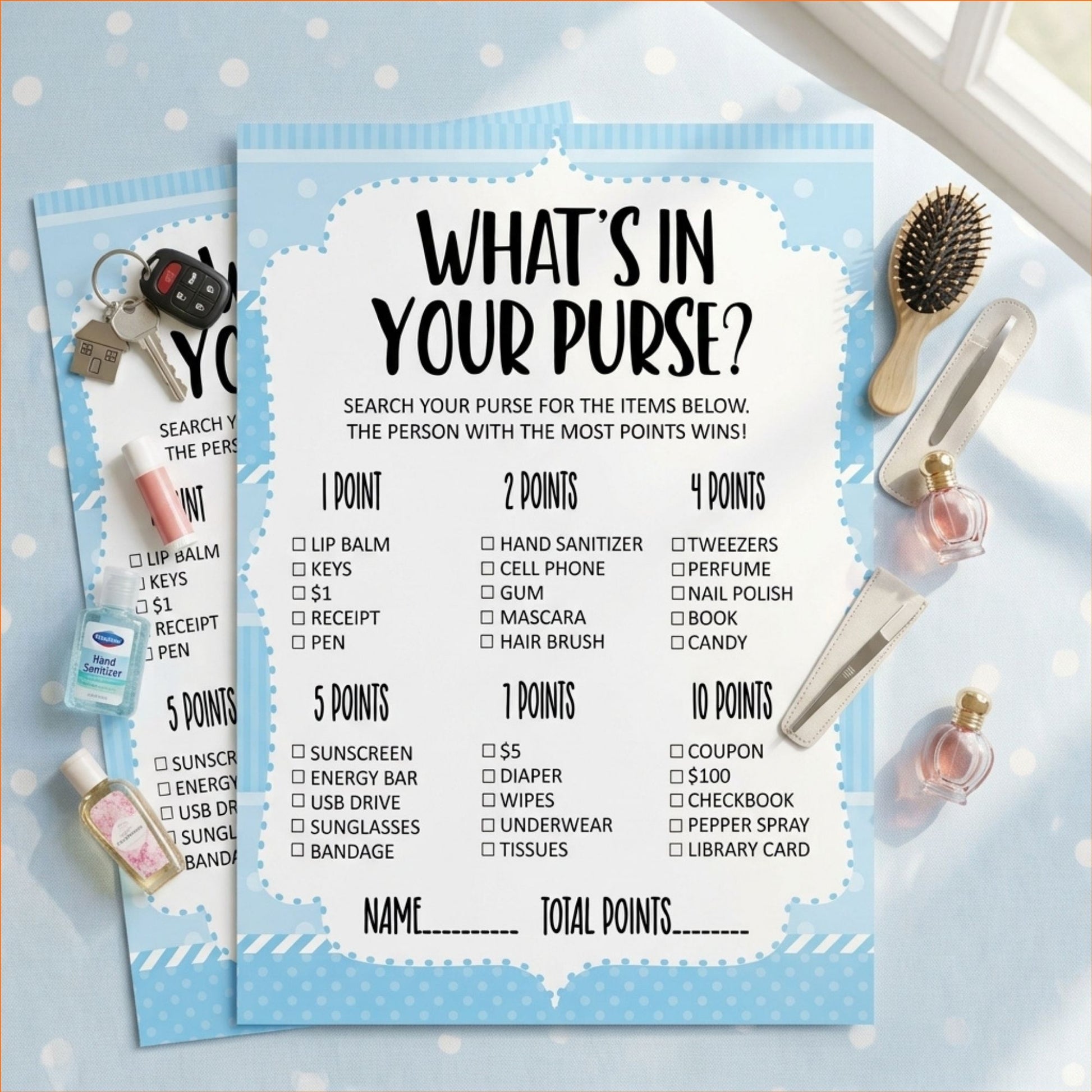 A blue and white 'What's in your purse?' party game board with checklist points, styled on a light surface with perfume bottles, a hairbrush, and keys around it.