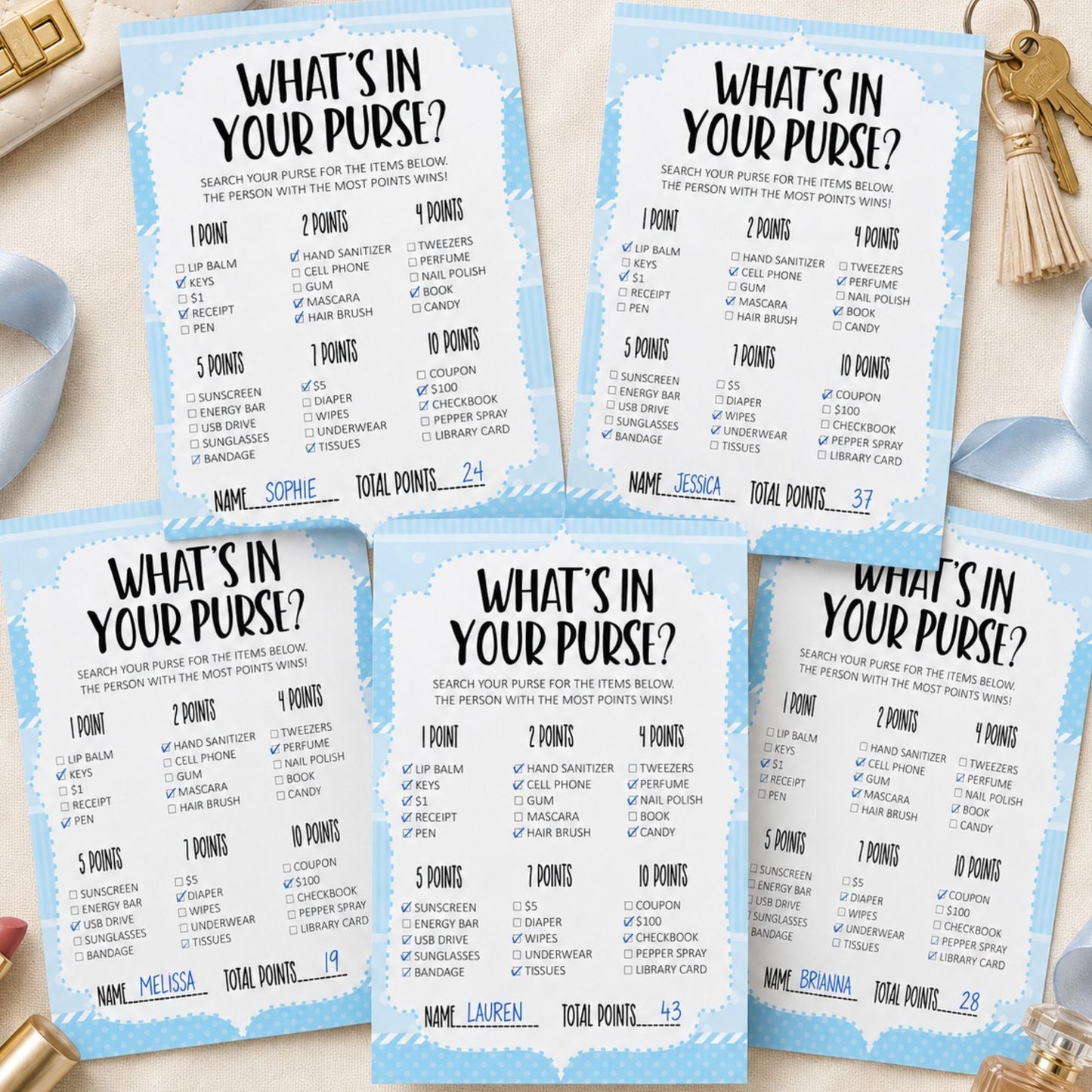Three blue and white 'What's in your purse?' point cards arranged on a light beige surface with gold coins and a small gold figurine nearby.