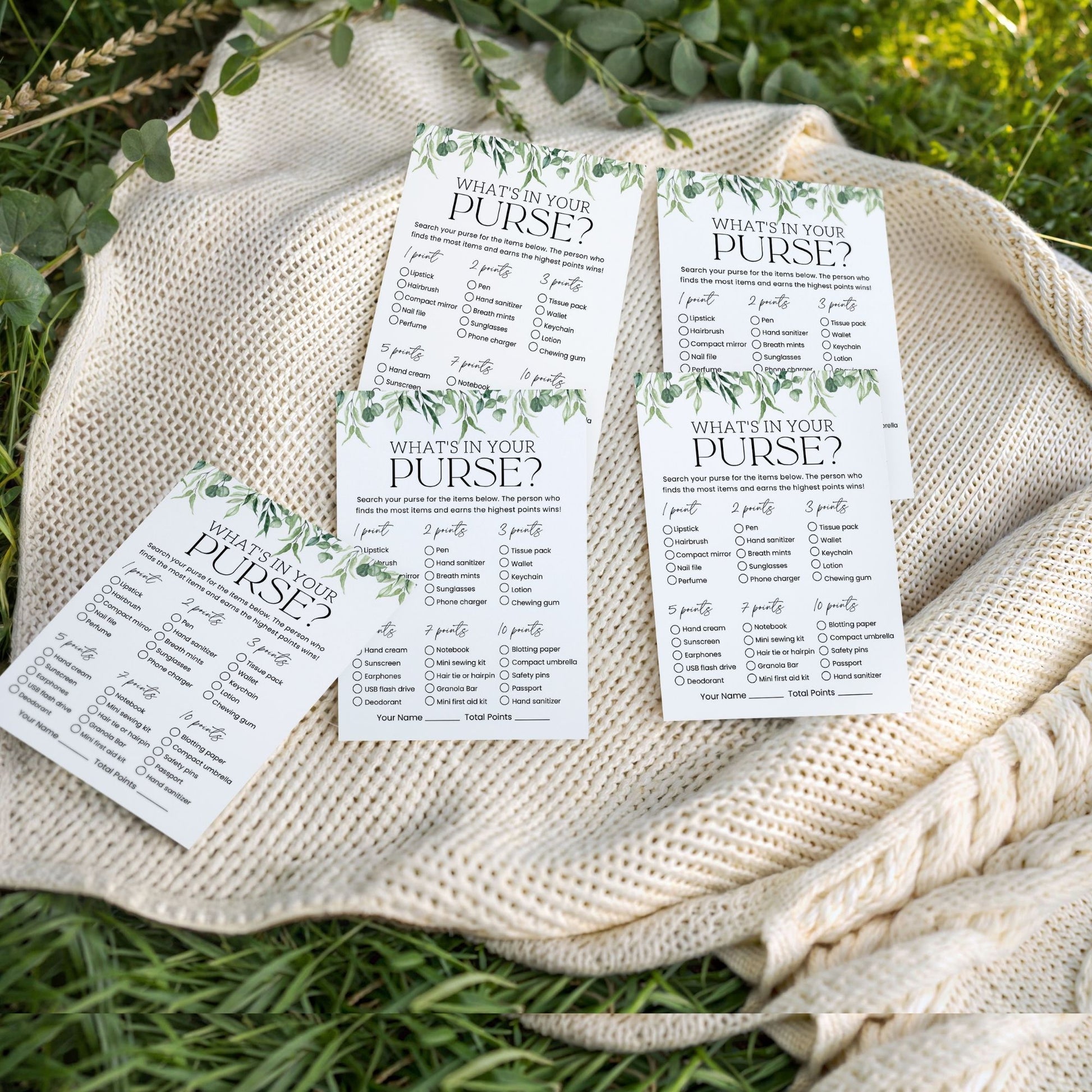 Four 'What's in your Purse?' question cards on a textured fabric background with greenery.