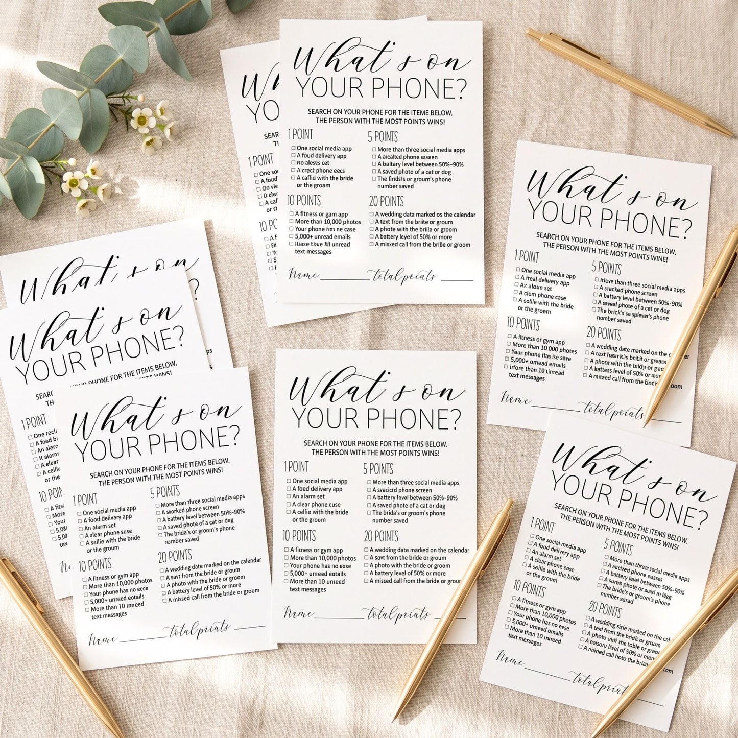 Six printed game cards titled "What son YOUR PHONE?" arranged on a light wood surface with greenery and gold-toned chopsticks. The cards are white with black text and decorative script headings.